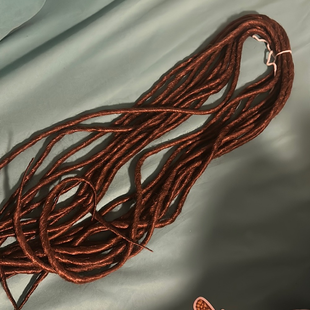 A bundle of new brown dread locks.